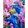 Blauwe papegaaien tussen de roze bloemen - 3